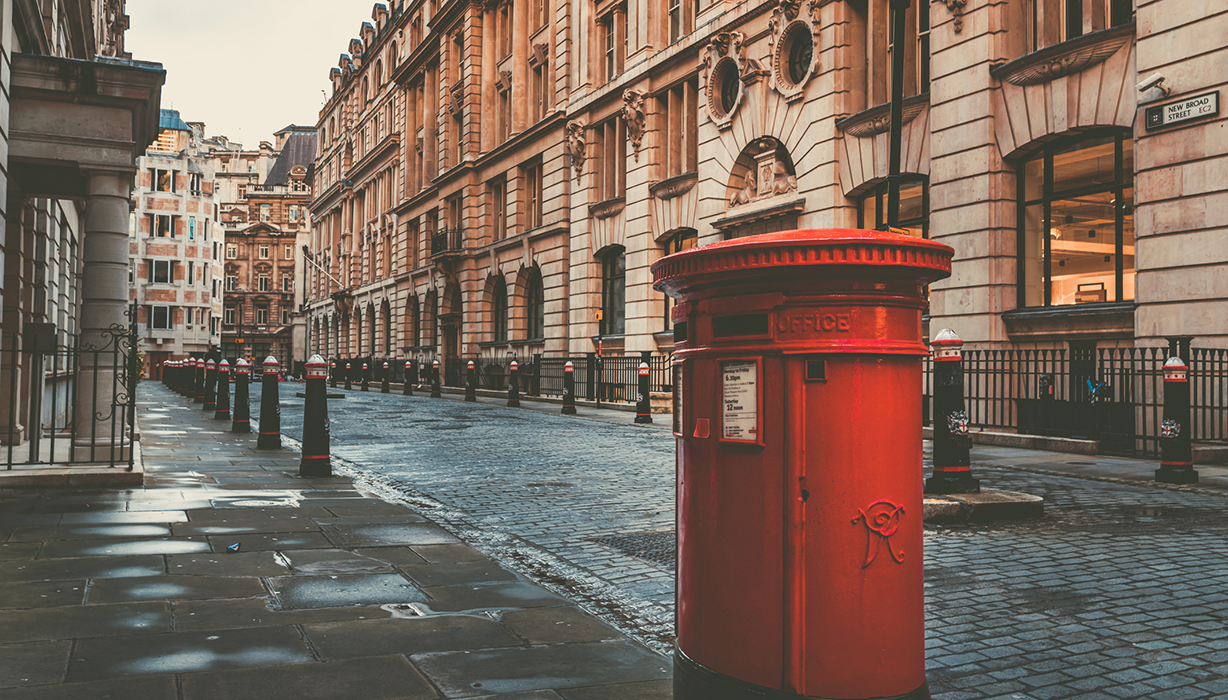 Red post box on the street