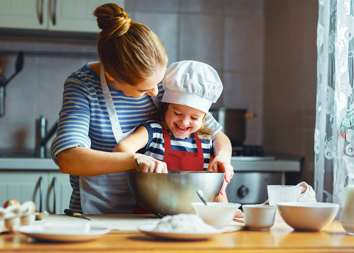 Mother and baby baking