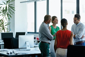 Group of people in an office talking
