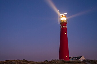 Red lighthouse at dusk