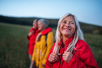 woman in red coat smiling