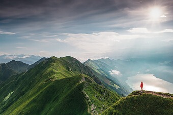 person in red coat on a mountain