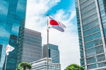 Japan flag with skyscrapers in the background