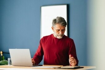 man looking at tablet