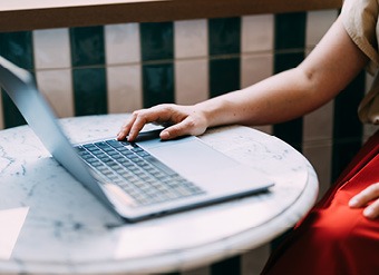 person typing on laptop
