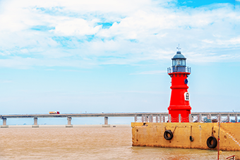red lighthouse and beach
