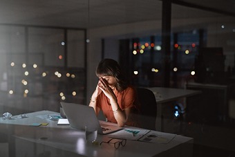 Women with head in hands 