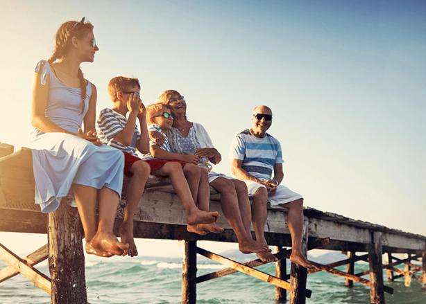 Family sat on pier