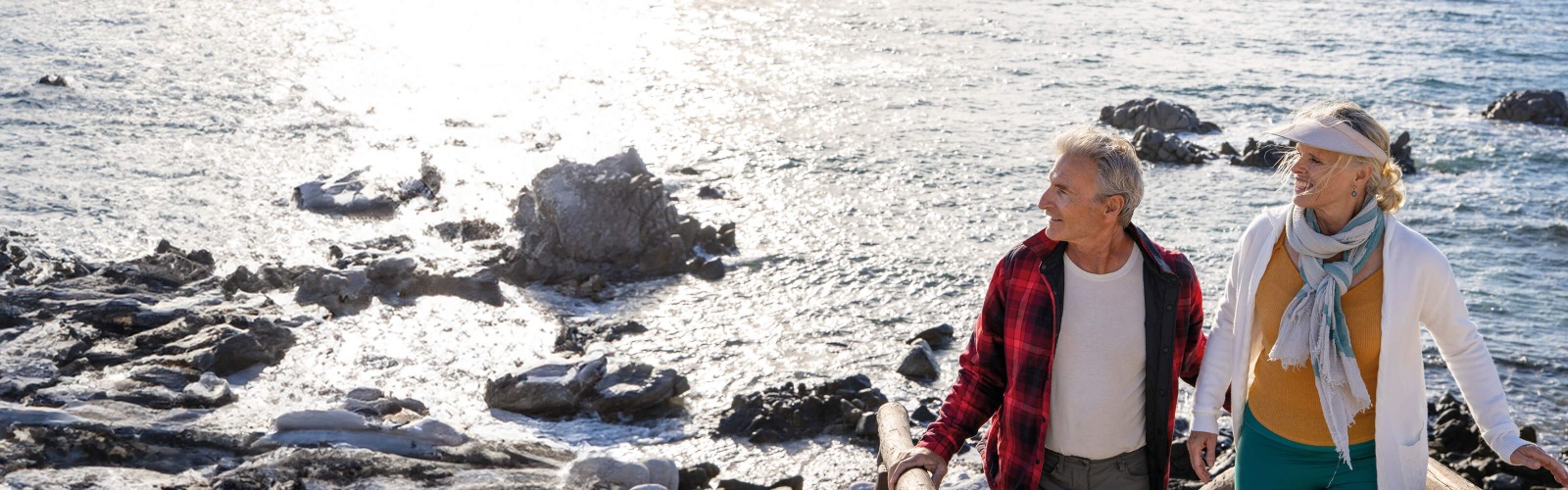 Couple hiking by a beach