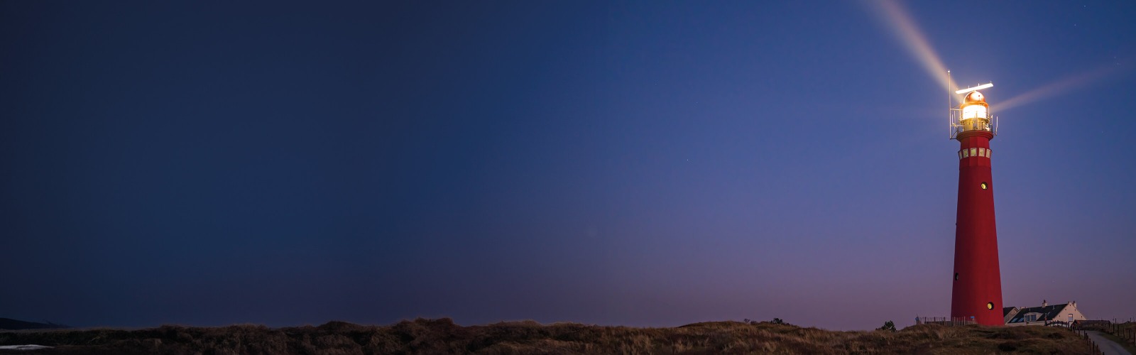 Red lighthouse at dusk