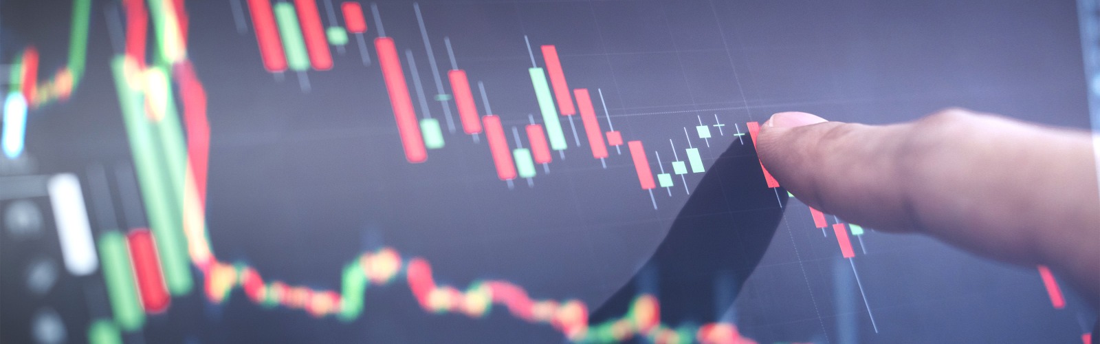 finger pointing at stock graph