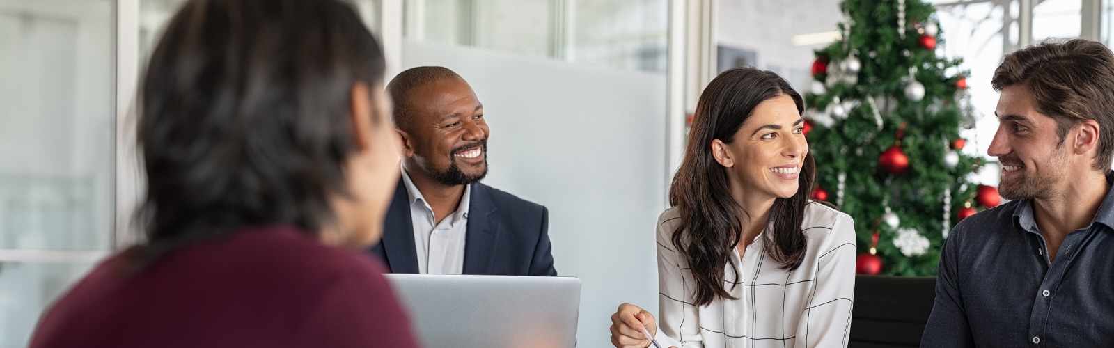 workers in a meeting at xmas time