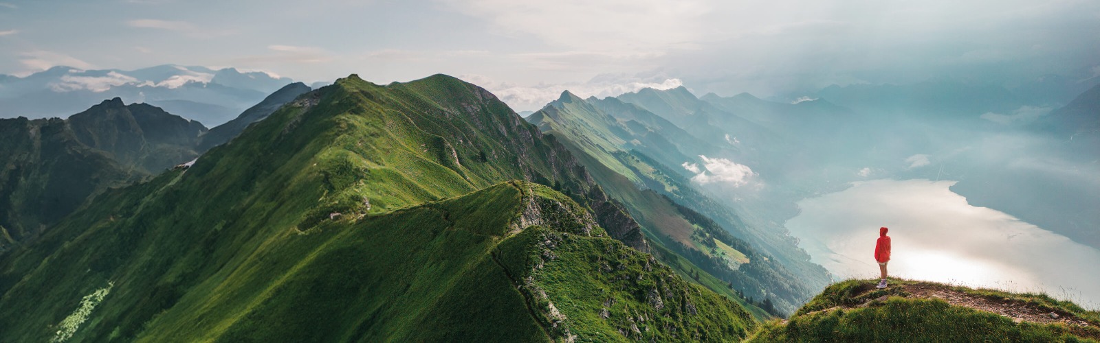 person in red coat on a mountain