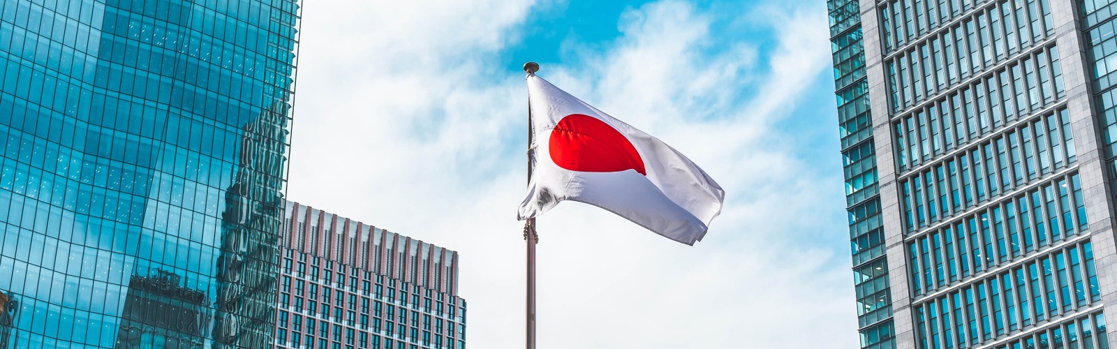Japan flag with skyscrapers in the background