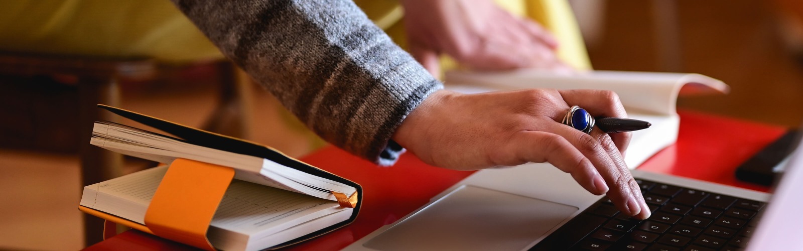 man typing on laptop