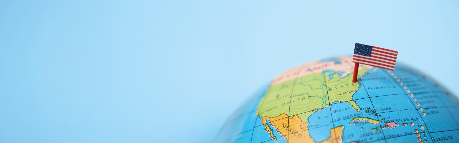 Globe with a US flag pinned to the USA 