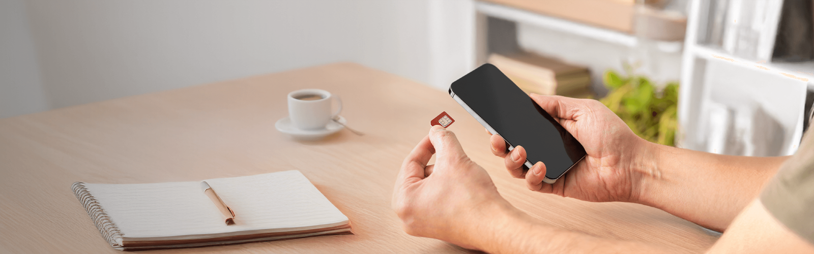 Person inserting sim into phone