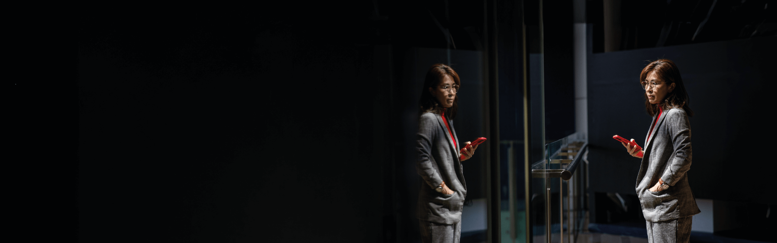 Woman standing on her phone