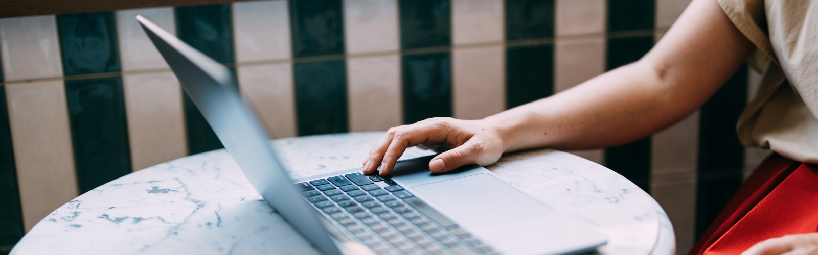 person typing on laptop