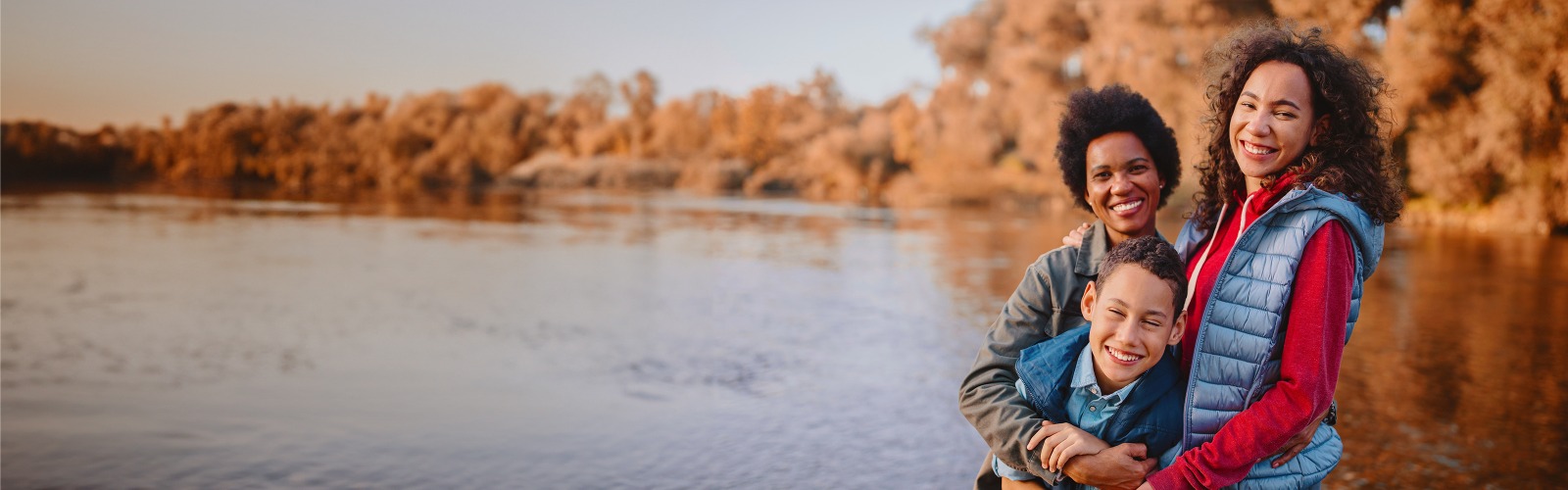 Mother with daughter and son in front of a lake