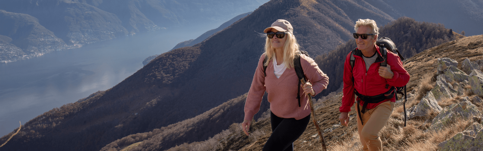 older couple hiking along mountain top