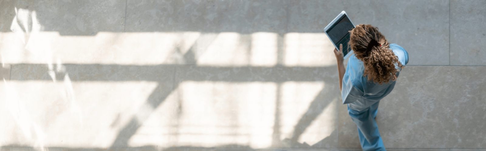 DOCTOR WALKING WITH PAD IN HAND