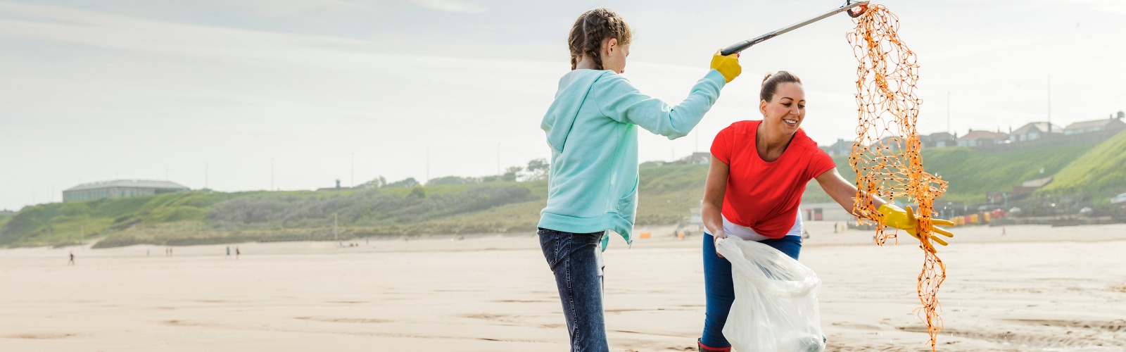 Family cleaning beach
