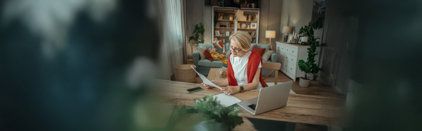 woman looking at paper