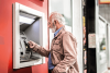 man at atm inserting card